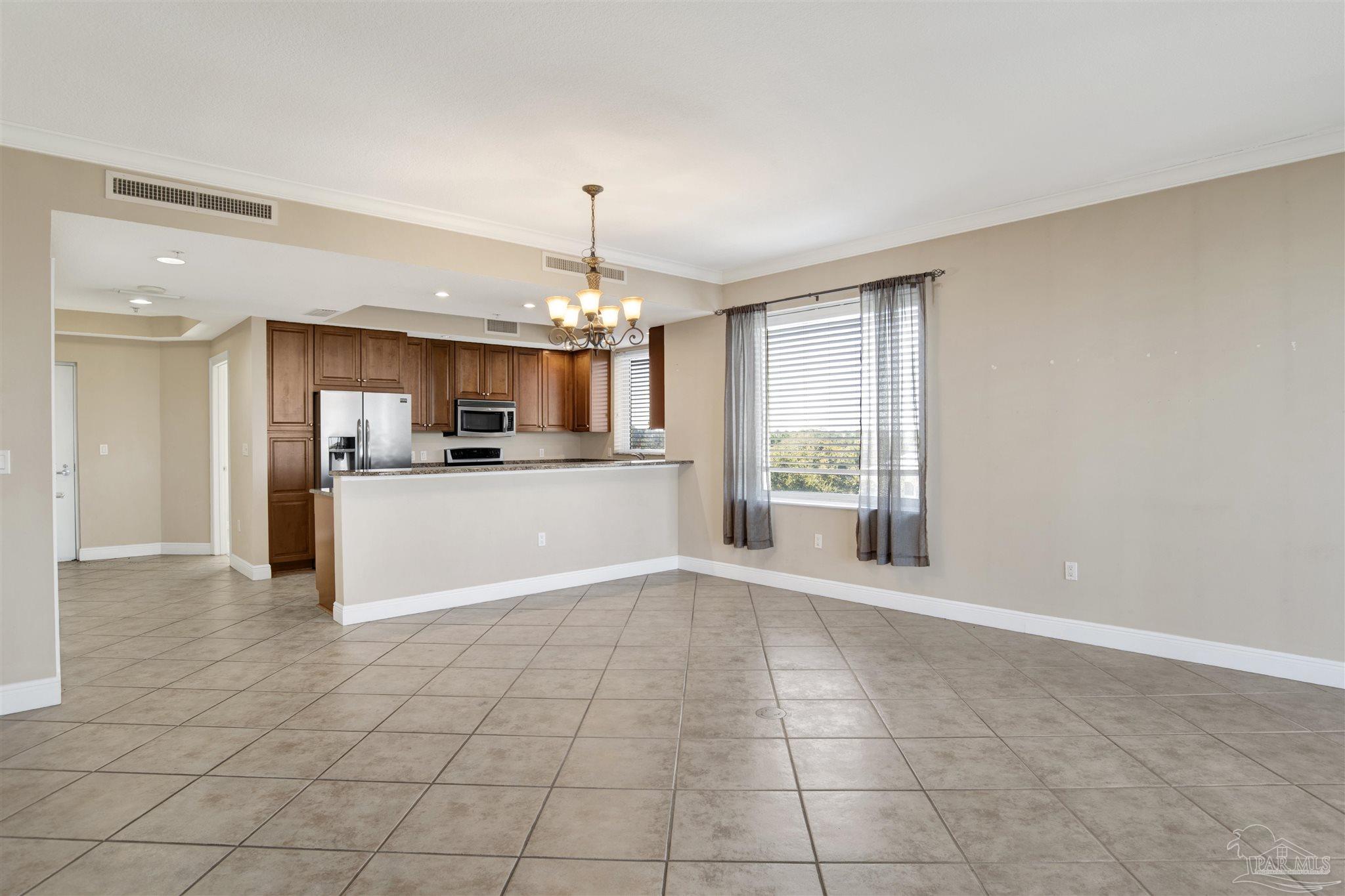 612 Lost Key Drive, Unit 401B Pensacola, FL 32507 - Photo 21 of 34 a view of a kitchen with furniture and a window