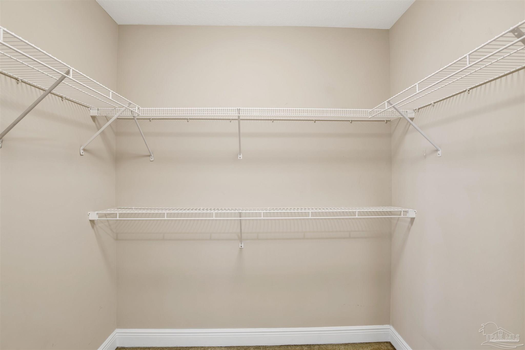 612 Lost Key Drive, Unit 401B Pensacola, FL 32507 - Photo 22 of 34 a view of a room with racks on the wall