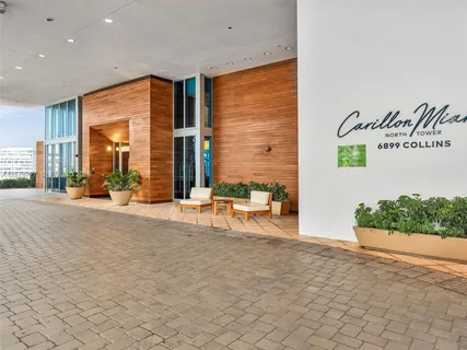 a view of a patio with table and chairs and potted plants