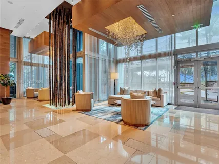 a building outdoor space with patio furniture and glass door