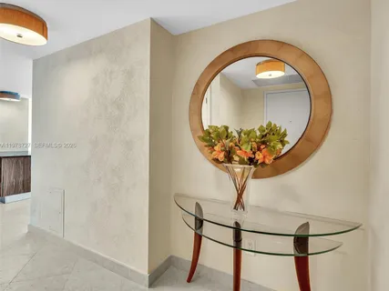 a vase with flowers sitting on a table