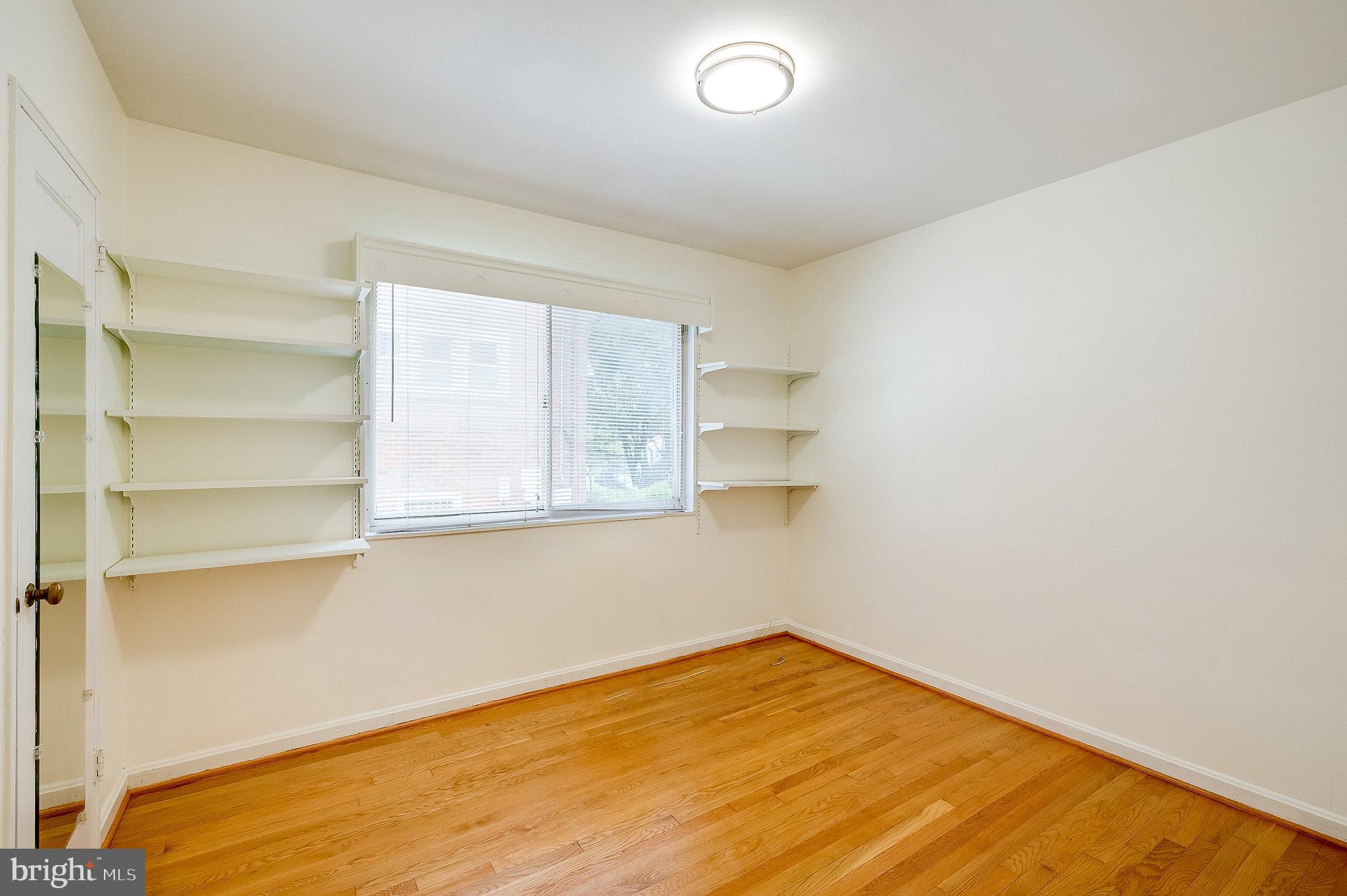 6159 1st Street Northeast Washington, DC 20011 - Photo 11 of 28 a view of empty room with wooden floor and fan