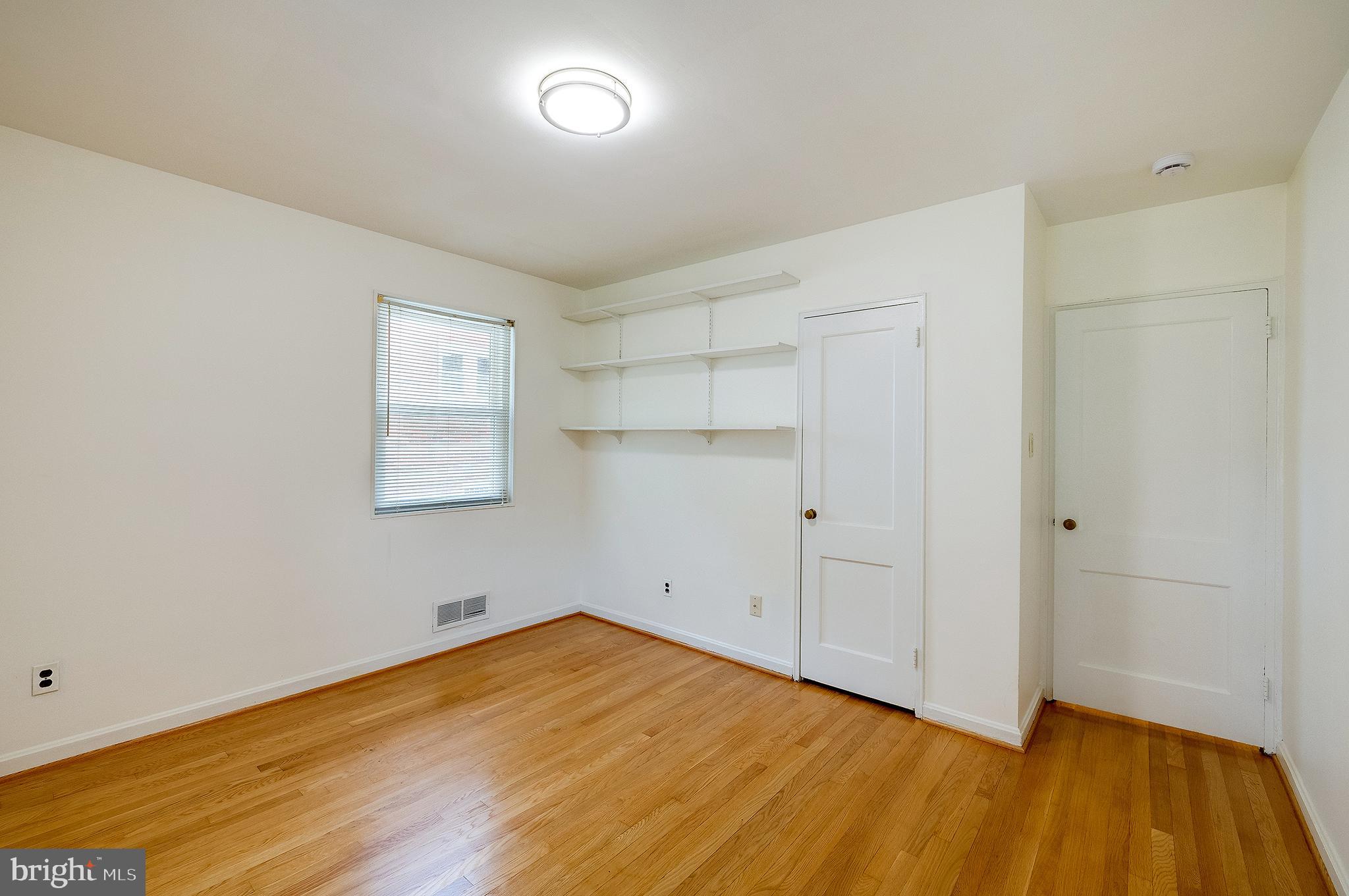 6159 1st Street Northeast Washington, DC 20011 - Photo 14 of 28 a view of empty room with wooden floor