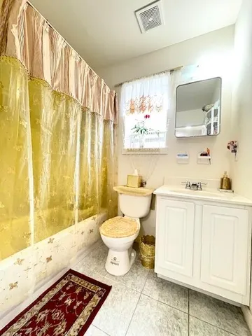 a room with a bed and a flat screen tv