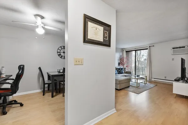 a view of a livingroom with furniture and a flat screen tv