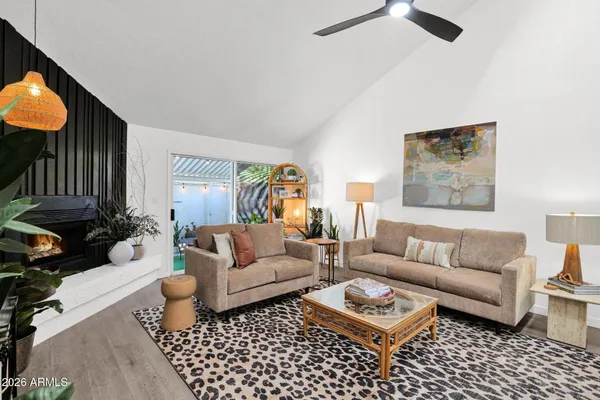 a living room with furniture and a rug
