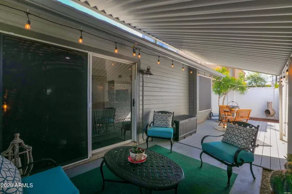 a outdoor living space with furniture and a potted plant