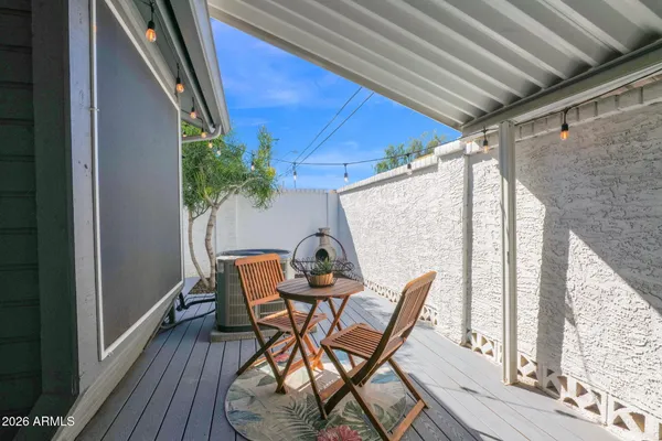 a outdoor living space with furniture and a potted plant