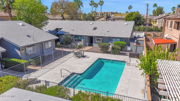 an aerial view of a house having swimming pool