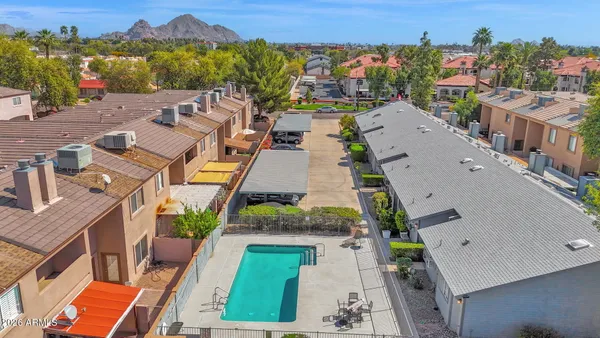 an aerial view of a house with swimming pool