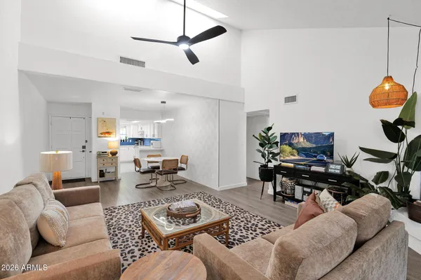 a living room with furniture and a fireplace