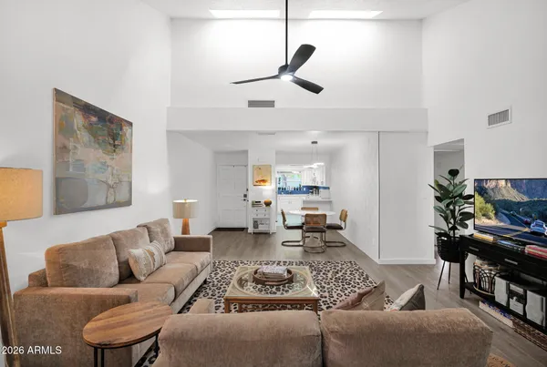 a living room with furniture and a flat screen tv