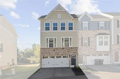 a view of a brick house with windows