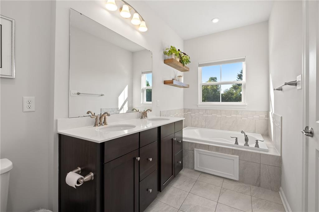 7208 Chestnut Way Gibsonia, PA 15044 - Photo 25 of 50 Primary bathroom tub, great for unwinding after a long day.