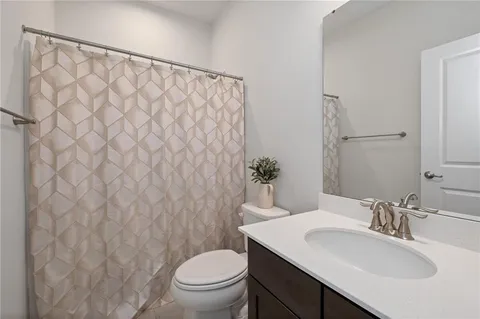 a bathroom with a sink and a toilet