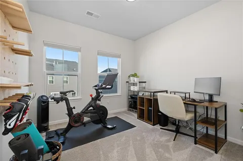 a view of a workspace with furniture and bedroom