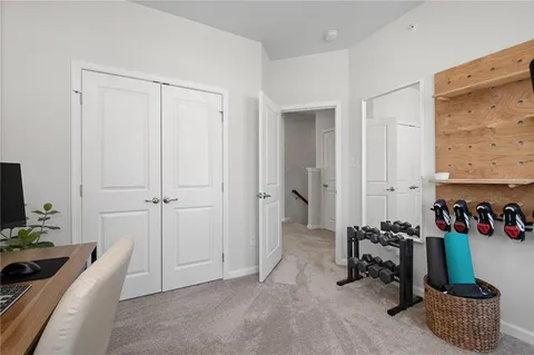 a room with furniture and a flat screen tv