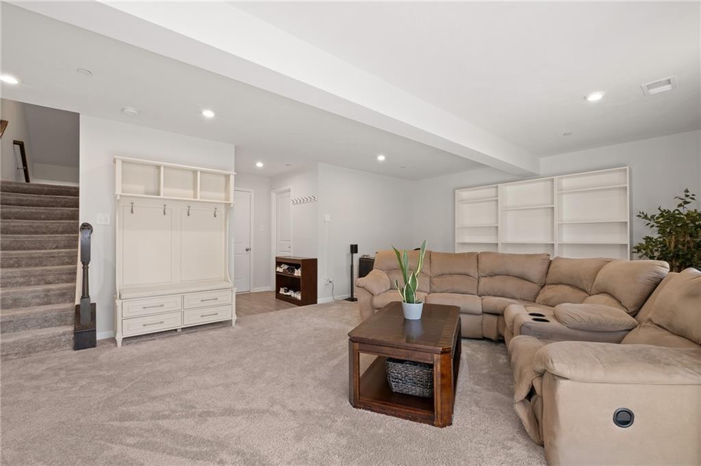 7208 Chestnut Way Gibsonia, PA 15044 - Photo 33 of 50 First floor media room with easy access to outdoor patio.