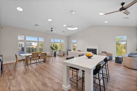 a view of a dining room with furniture window and wooden floor