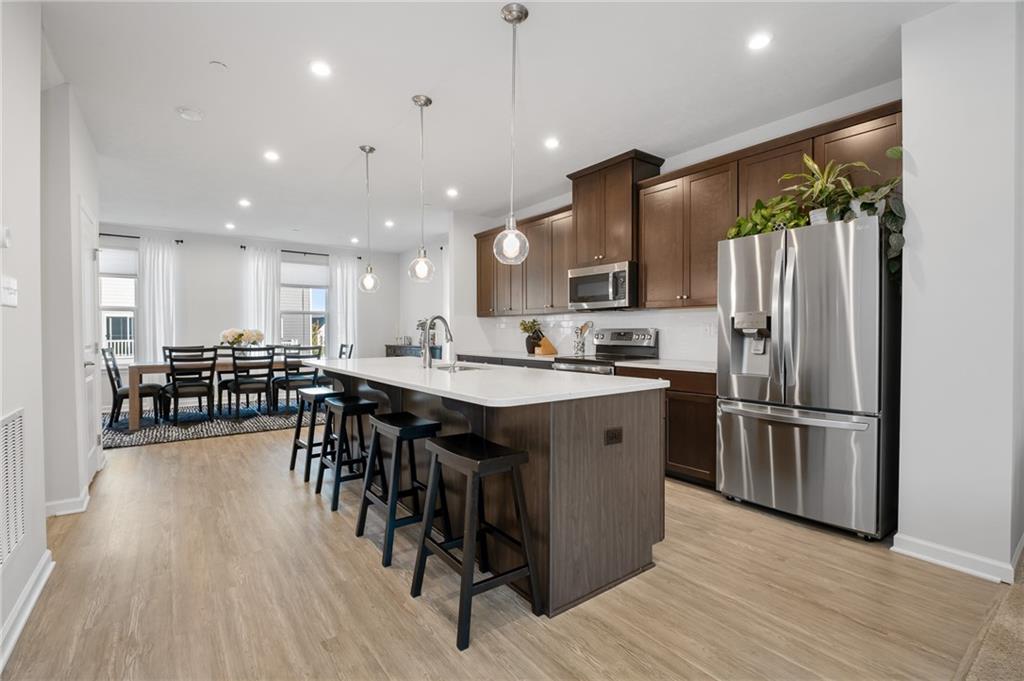 7208 Chestnut Way Gibsonia, PA 15044 - Photo 10 of 50 Open kitchen with large countertops and plenty of seating.
