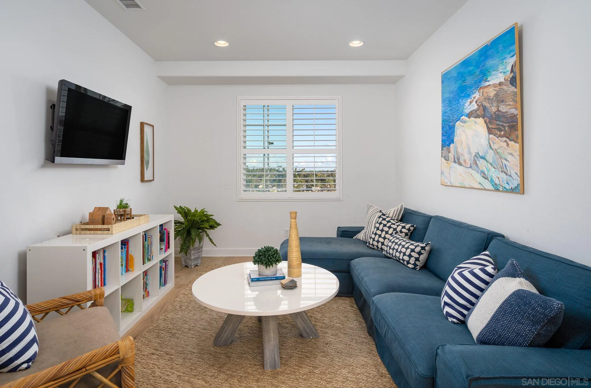 7229 Sitio Lima Carlsbad, CA 92009 - Photo 18 of 36 a living room with furniture and a flat screen tv