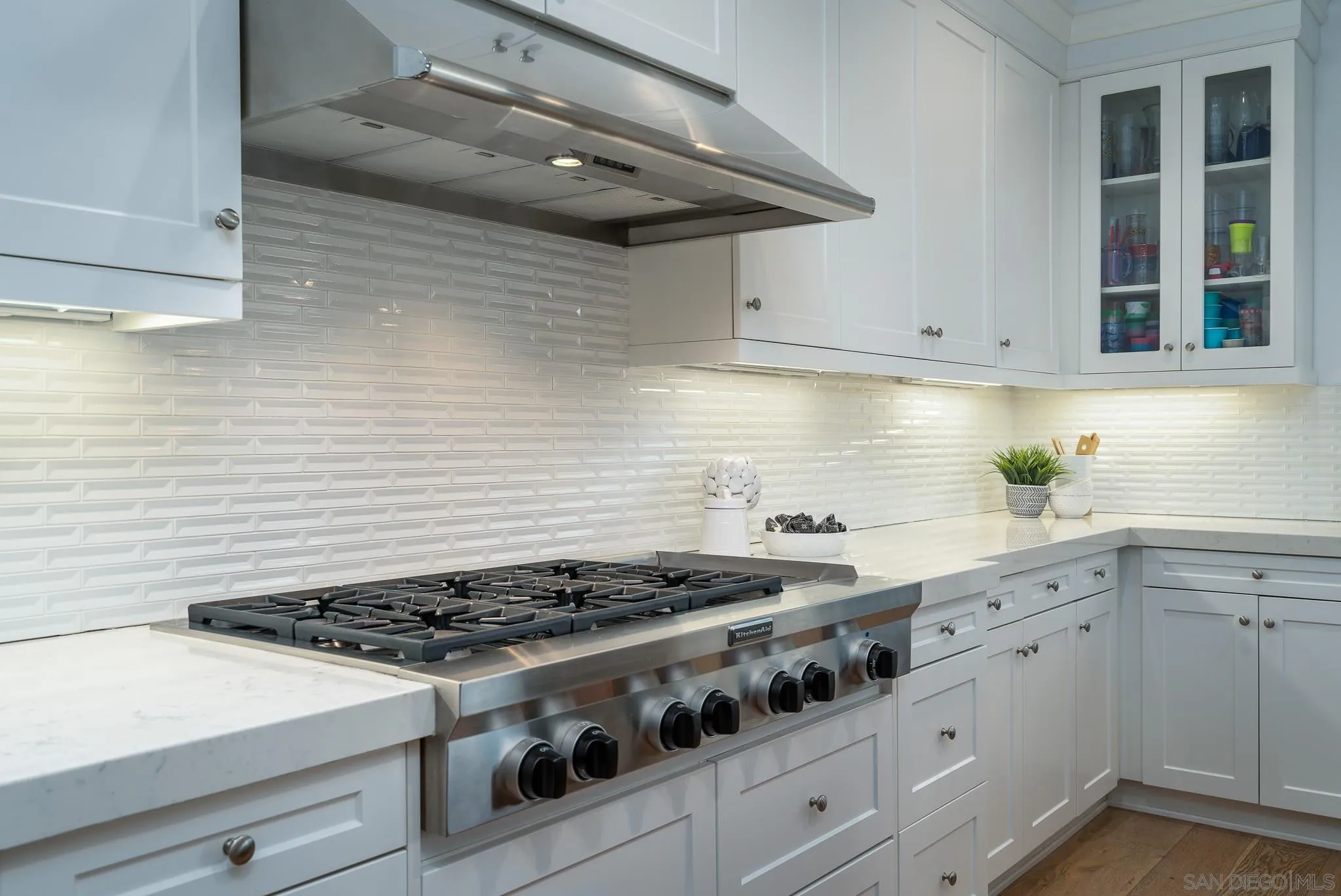 7229 Sitio Lima Carlsbad, CA 92009 - Photo 6 of 36 a white stove top oven sitting inside of a kitchen