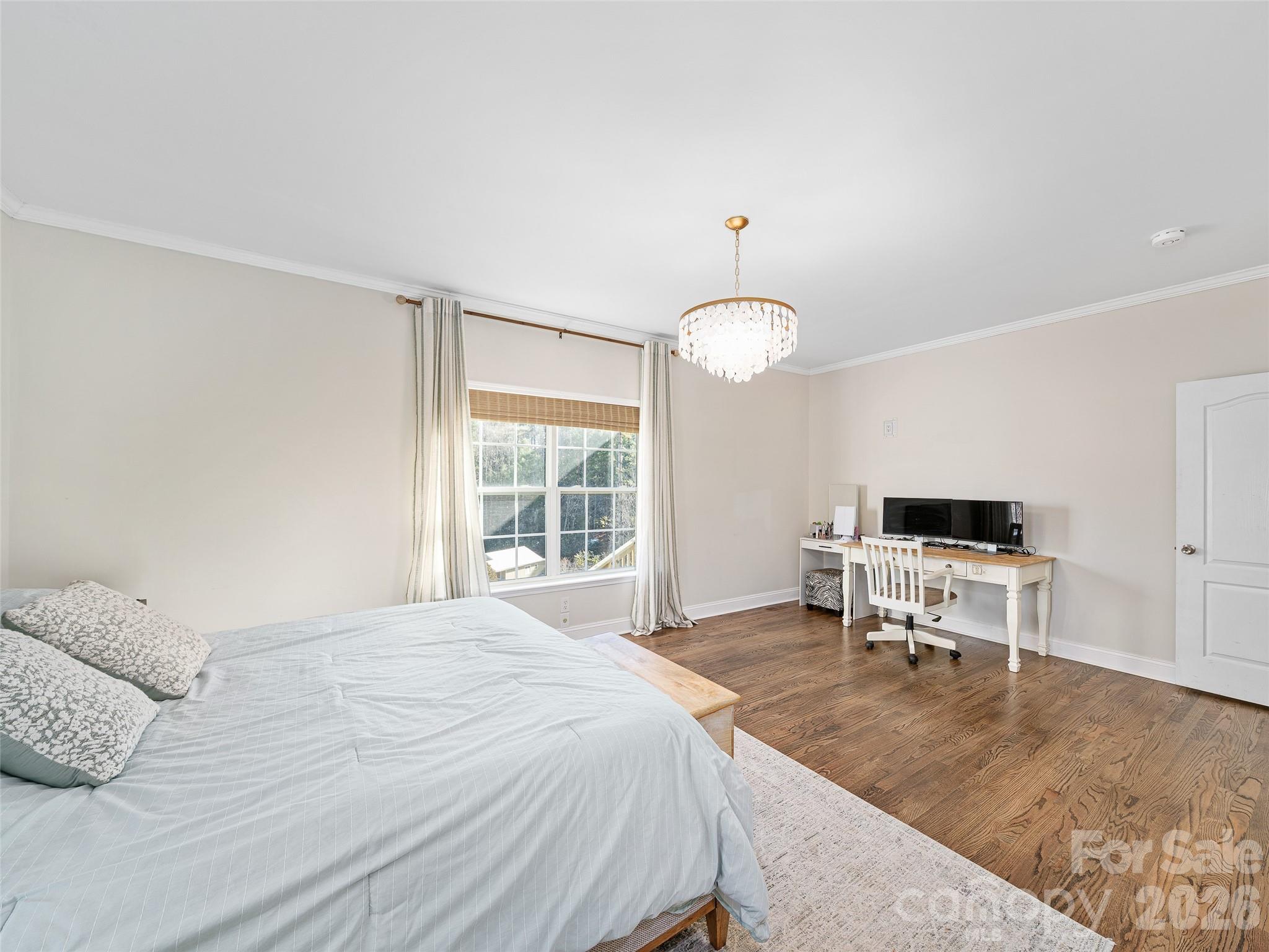 221 Creed Pitman Road Spruce Pine, NC 28777 - Photo 11 of 27 a bedroom with a bed and a chair