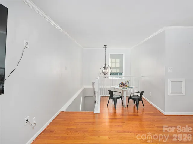 a dining room with furniture wooden floor and a rug