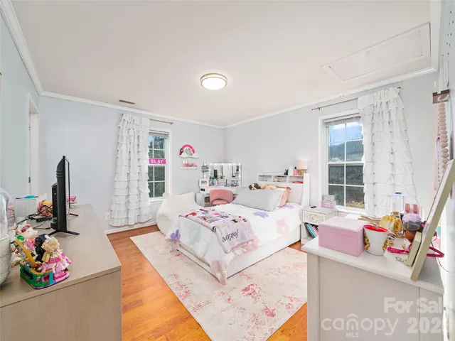 a bed room with a bed furniture and a window