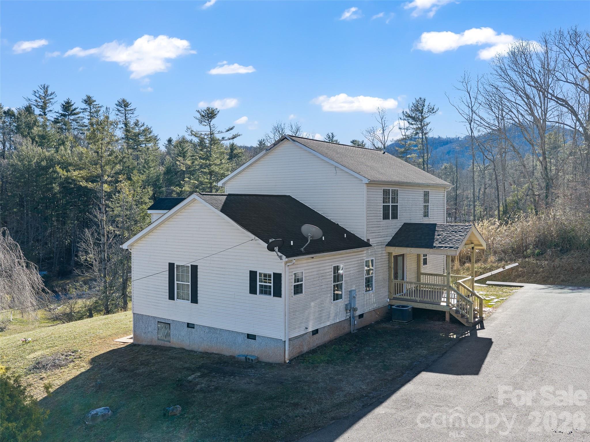 221 Creed Pitman Road Spruce Pine, NC 28777 - Photo 24 of 27 a view of a house with a yard