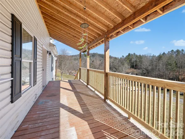 a view of a balcony with wooden floor