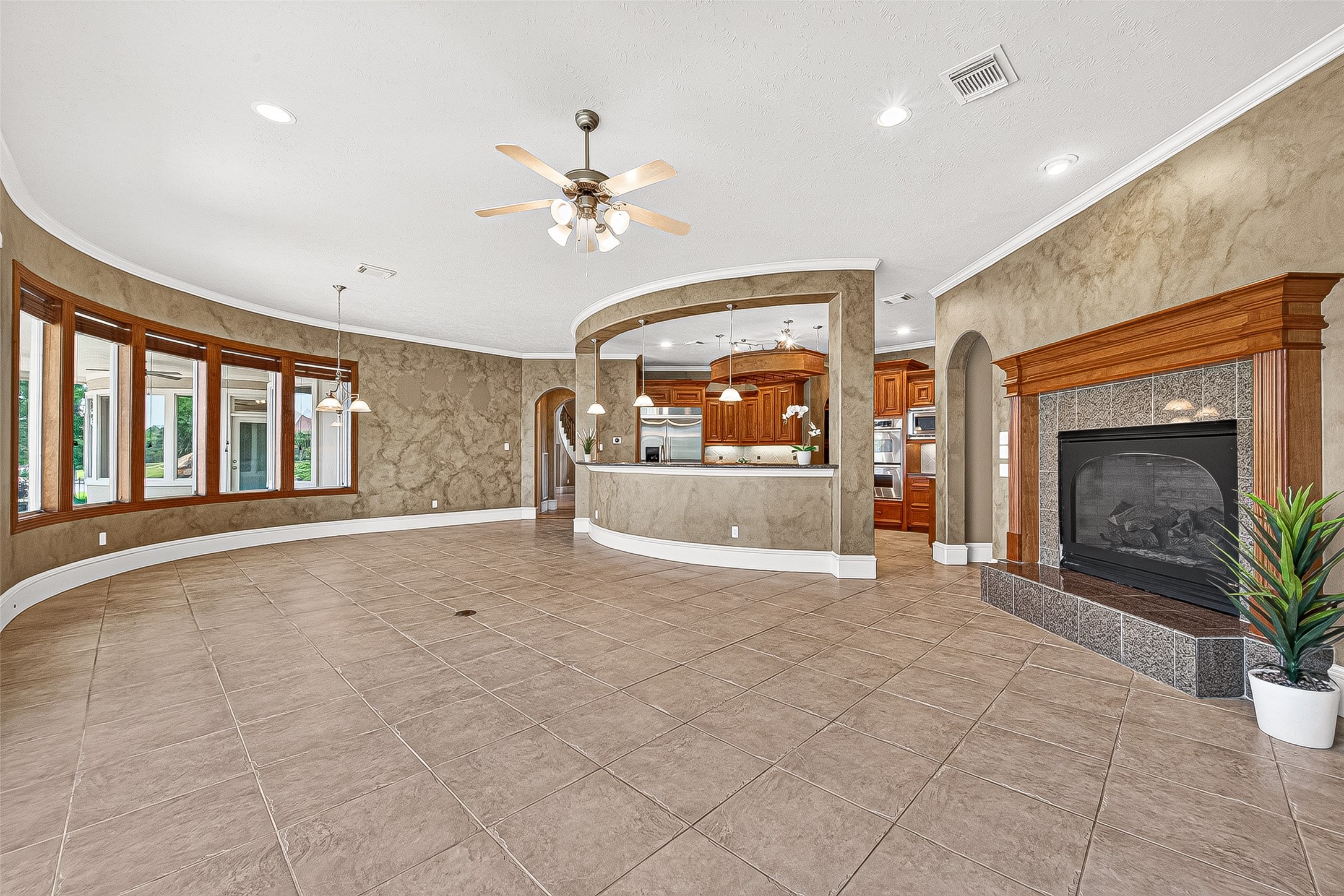 25626 Windy Isle Court Spring, TX 77389 - Photo 13 of 45 It is open to a fully equipped kitchen with a curved breakfast bar. Ideal for comfortable living and entertaining.