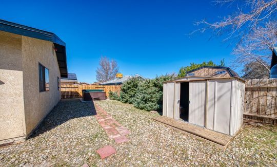 318 Reese Street Ridgecrest, CA 93555 - Photo 5 of 34 a view of a house with a backyard