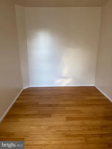 a view of walk in closet with clothes