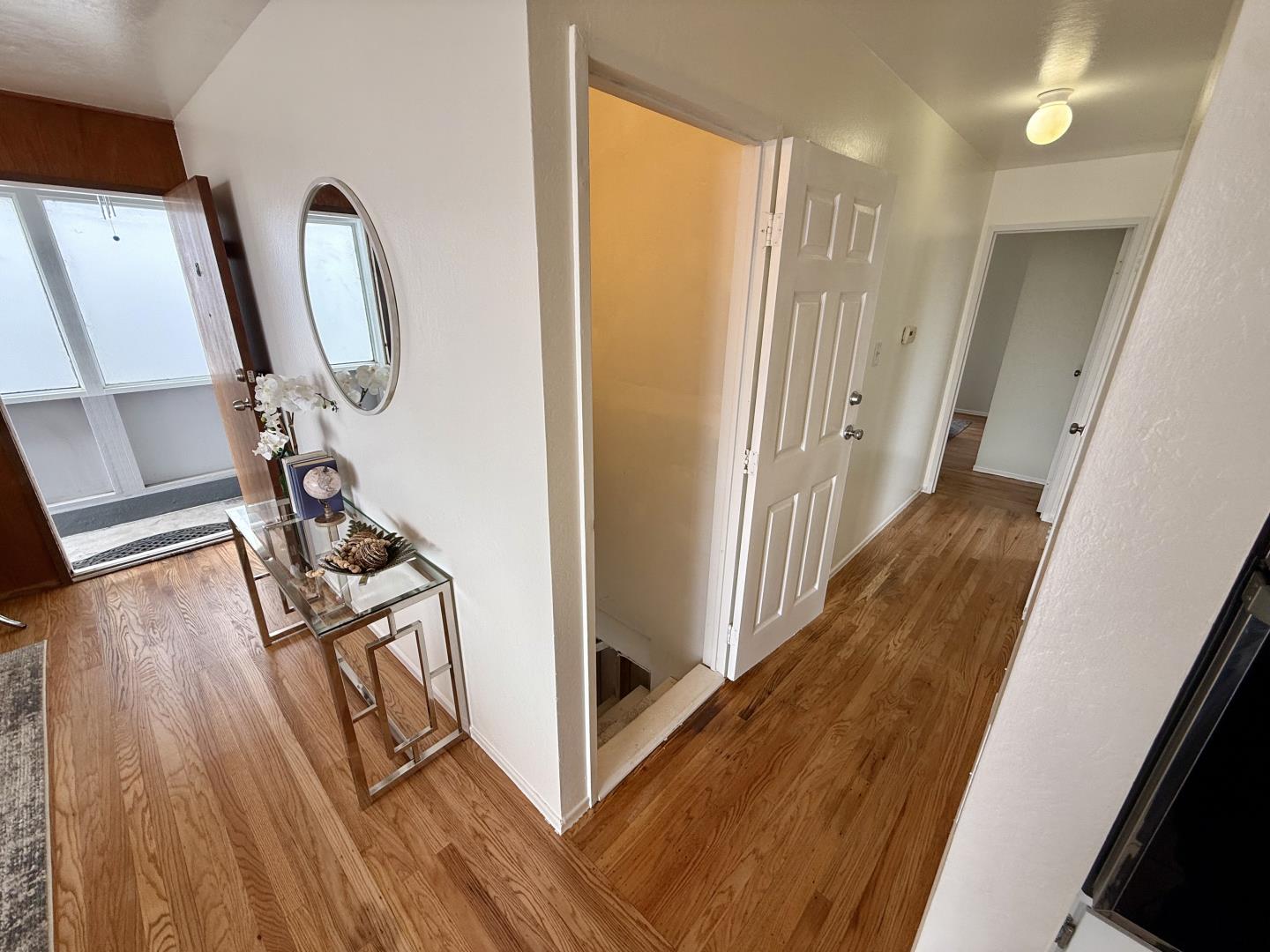 95 Clearview Drive Daly City, CA 94015 - Photo 11 of 21 a view of a hallway with wooden floor and stairs