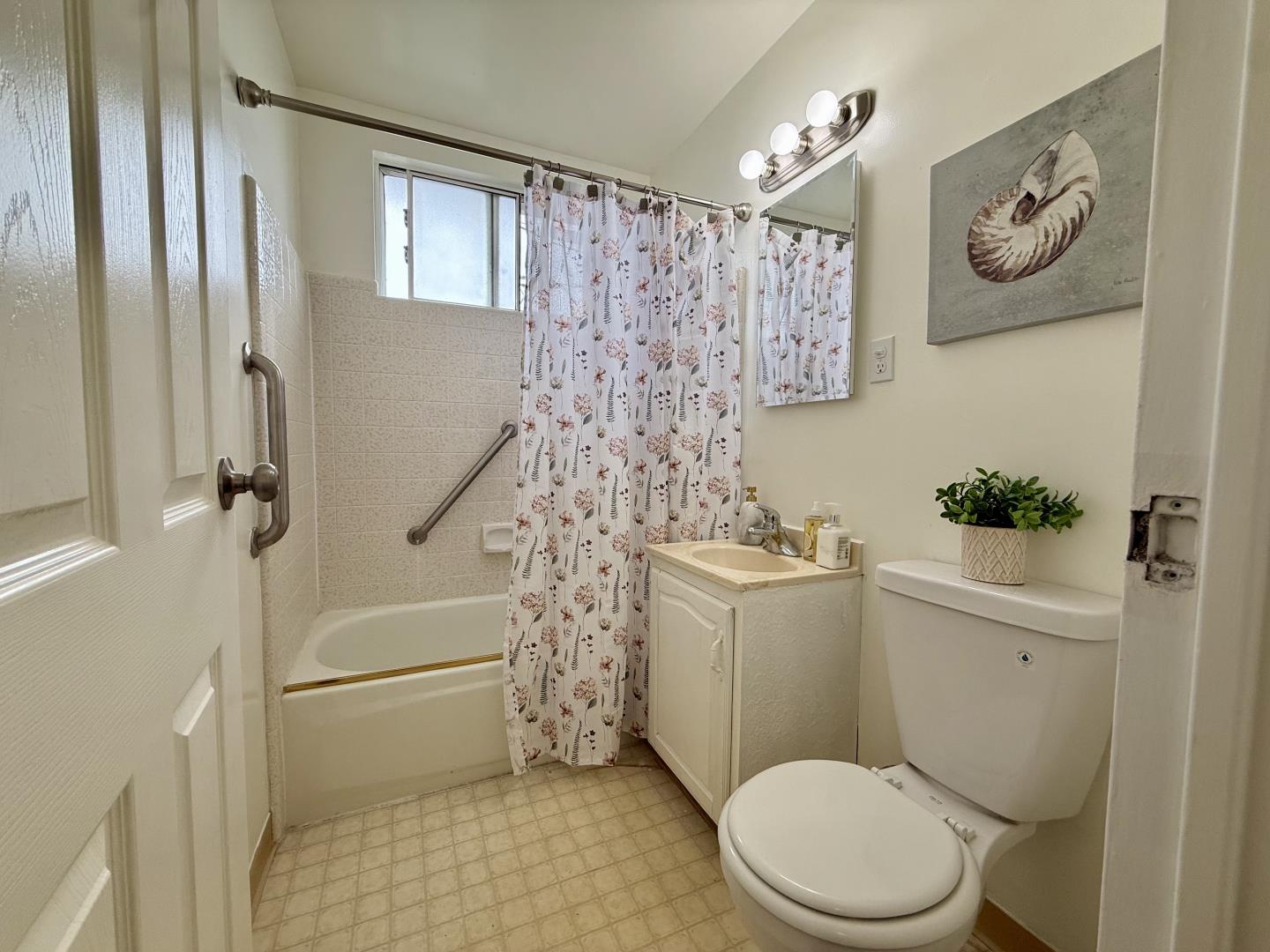 95 Clearview Drive Daly City, CA 94015 - Photo 10 of 21 a white toilet sitting next to a bathroom sink and a shower