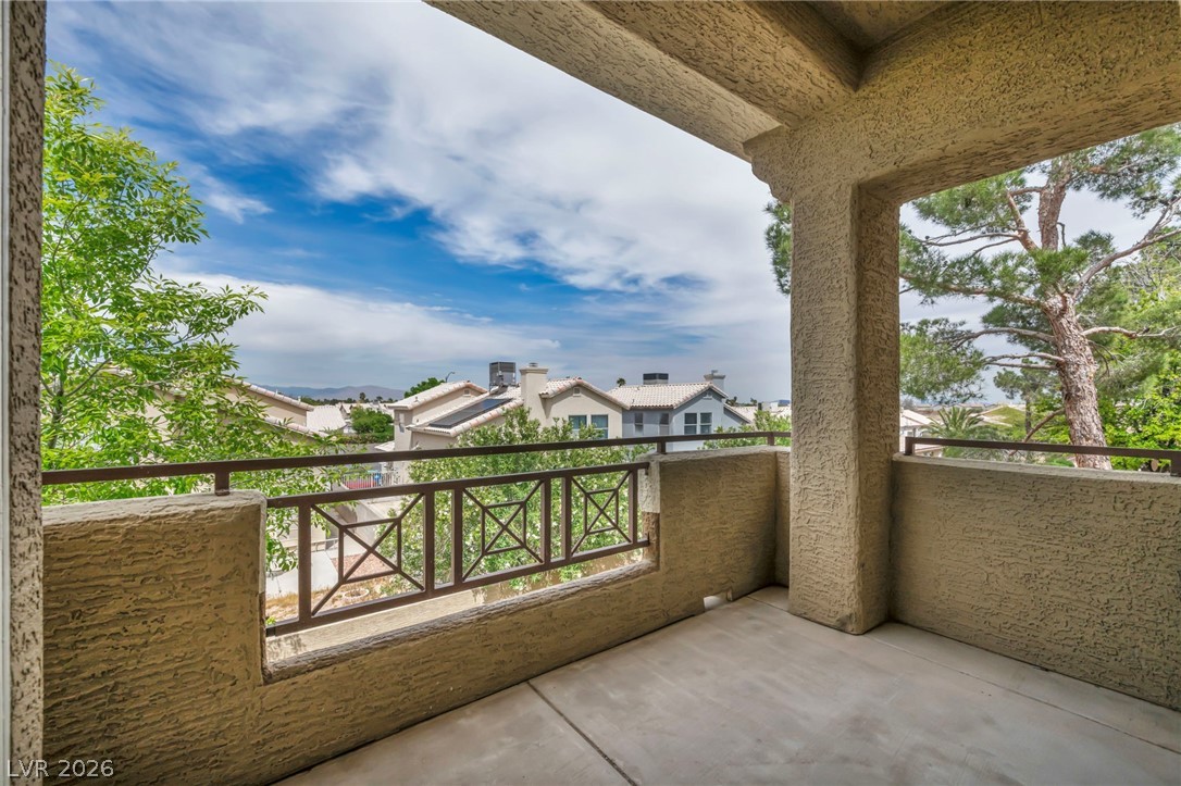 8070 West Russell Road, Unit 2060 Las Vegas, NV 89113 - Photo 34 of 47 This private balcony offers a charming view of the surrounding neighborhood and distant mountains.