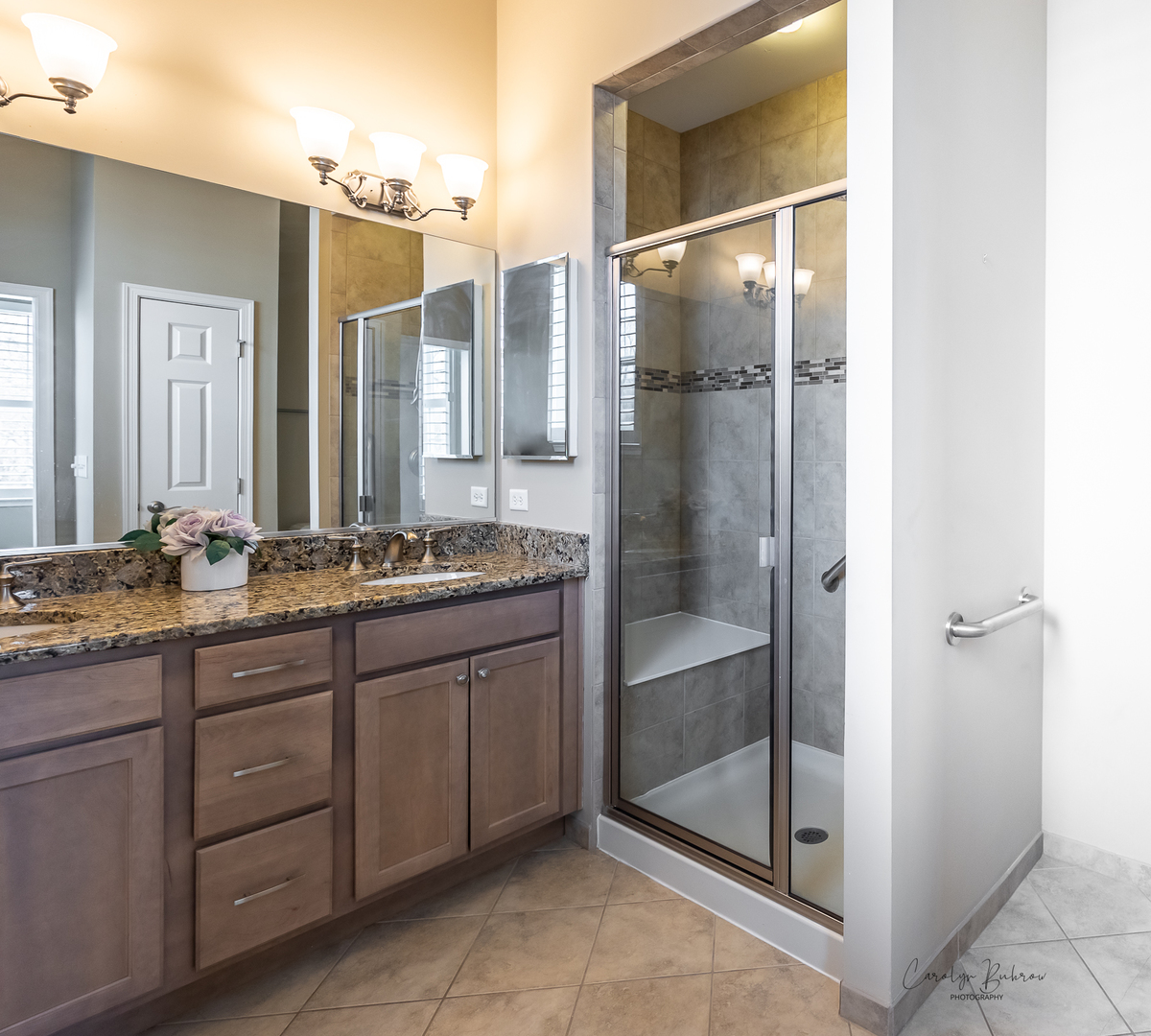 3870 Eagle Ridge Drive Elgin, IL 60124 - Photo 12 of 20 a bathroom with a double vanity sink and a mirror