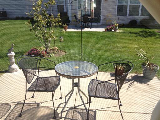 13616 Hemlock Road Huntley, IL 60142 - Photo 15 of 16 a view of an chairs and tables in the patio