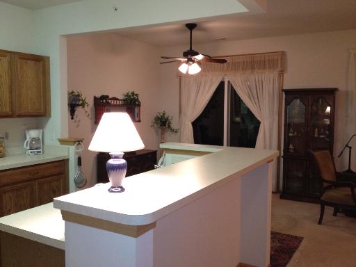 13616 Hemlock Road Huntley, IL 60142 - Photo 3 of 16 a kitchen with a table a sink and a refrigerator
