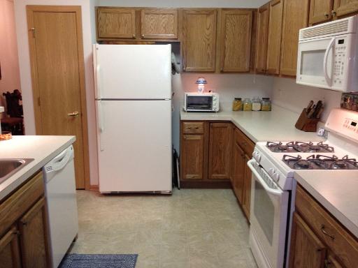 13616 Hemlock Road Huntley, IL 60142 - Photo 6 of 16 a kitchen with a refrigerator stove and microwave
