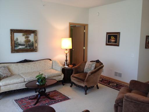 13616 Hemlock Road Huntley, IL 60142 - Photo 9 of 16 a living room with furniture and a rug