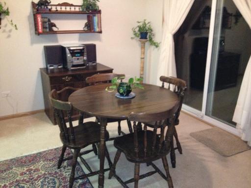 13616 Hemlock Road Huntley, IL 60142 - Photo 10 of 16 a view of a dining room with furniture and wooden floor