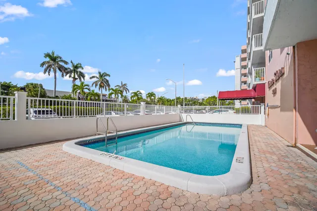 a view of a swimming pool with a lounge chairs