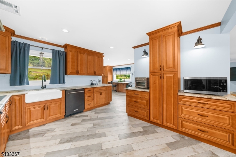 650 Woodglen Road Glen Gardner, NJ 08826 - Photo 7 of 28 a large kitchen with stainless steel appliances granite countertop a refrigerator and a stove top oven
