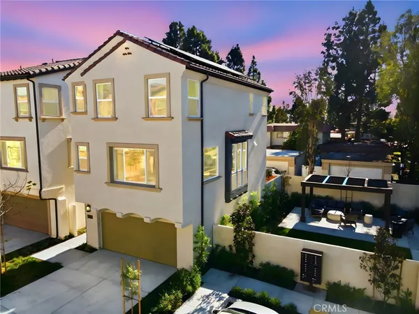 a front view of a house with outdoor space