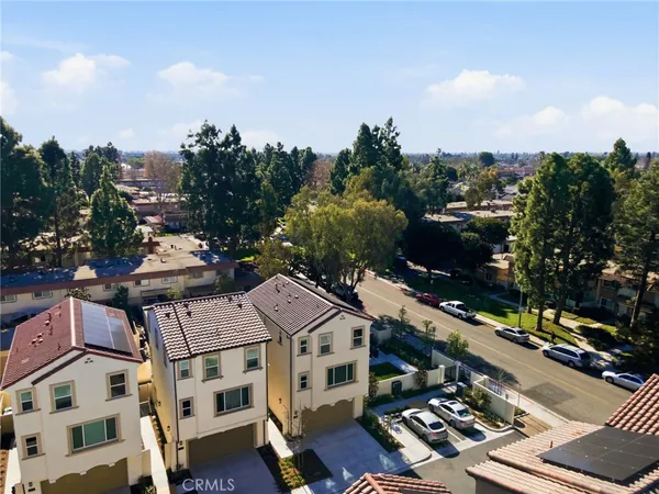 a view of empty room with wooden floor and fireplace