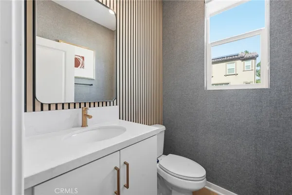 a view of kitchen with furniture and wooden floor