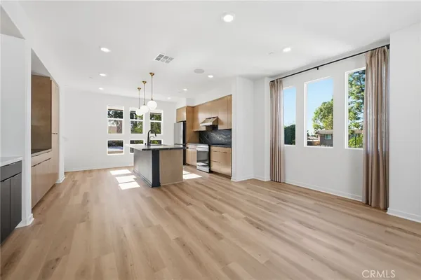 a view of living room with furniture and flat screen tv