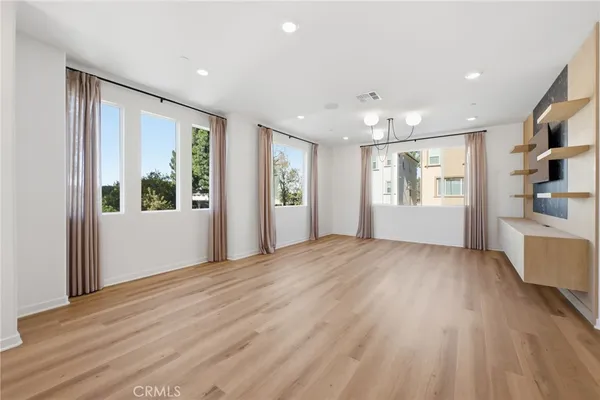 a view of entryway with wooden floor and door